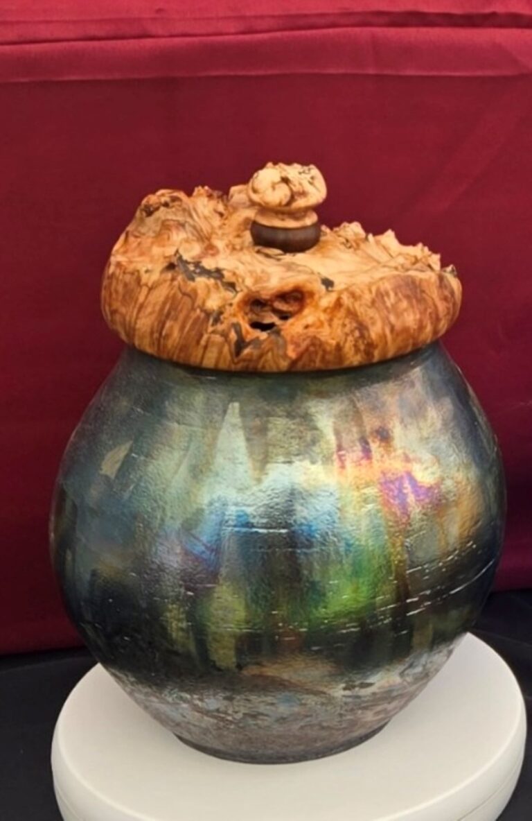 A handmade metal receptacle.