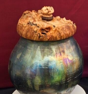 A handmade metal receptacle.