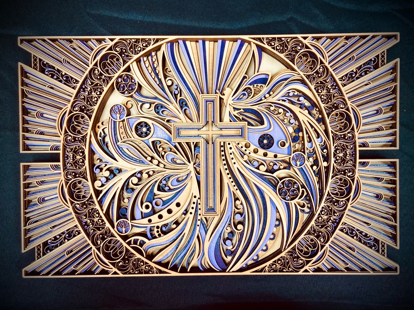 An intricate wooden design with a cross in the center.