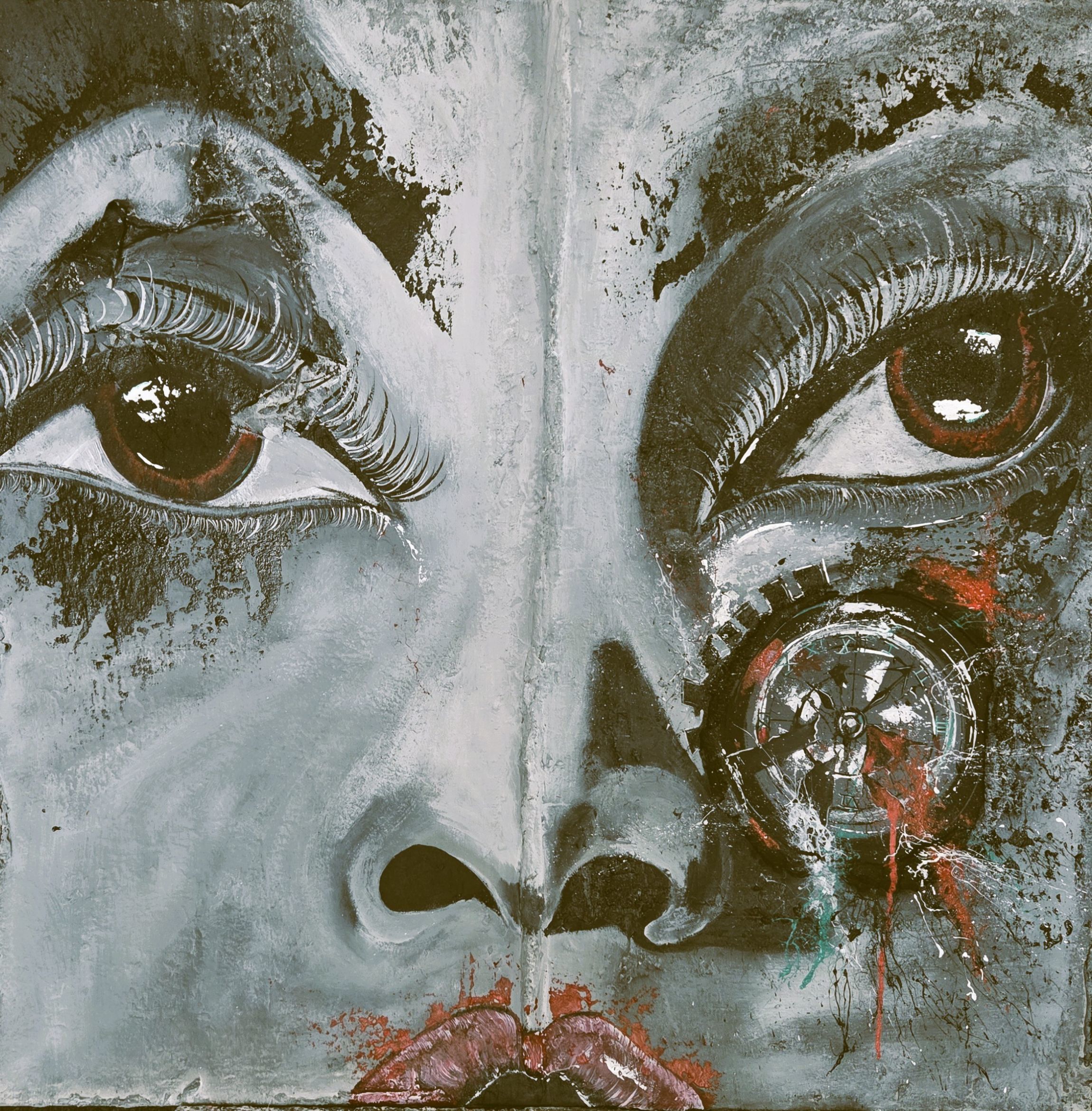 A painted face with abstract splatters overtop.