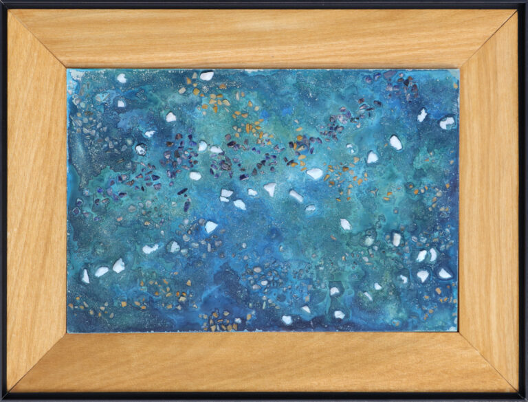 Concrete art inside a wood frame.