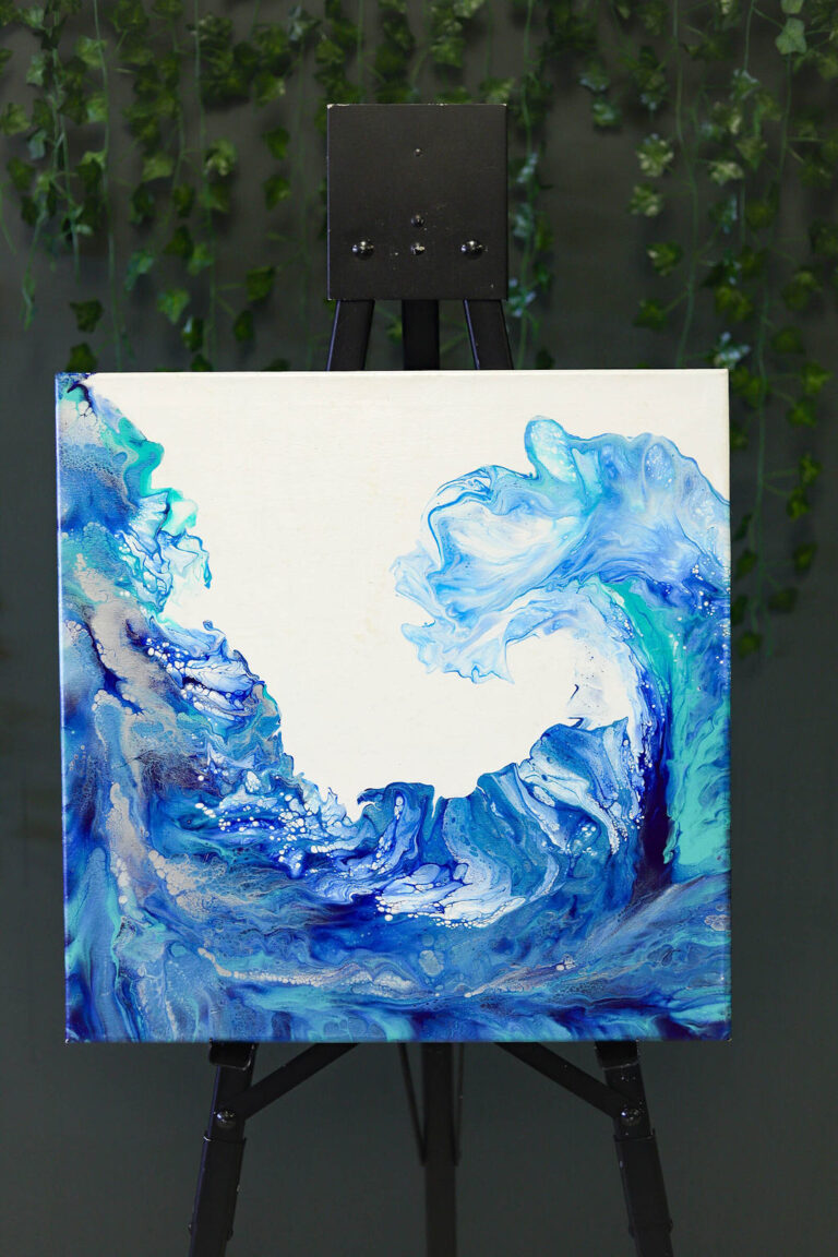 An acrylic painting of rough waves on a canvas.